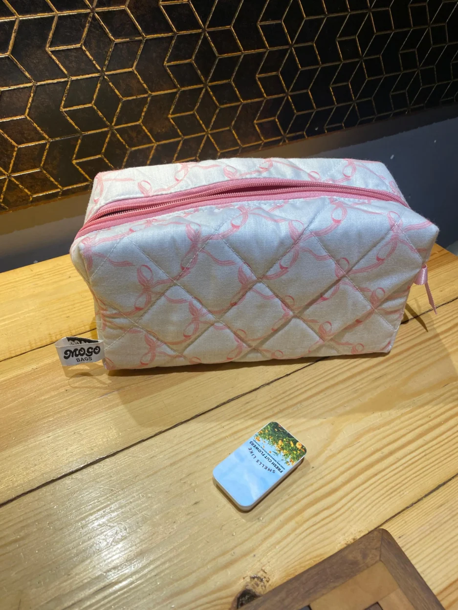 blush bow pouch