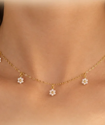 Handmade pearl floral necklace on a gold-tone chain